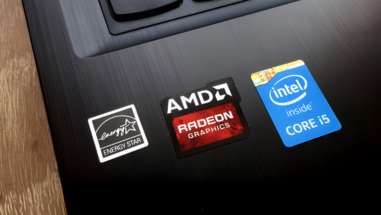 AMD and Intel logo on a laptop surface